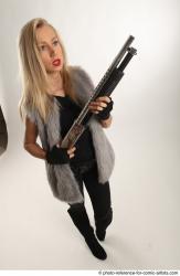 NIKOL STANDING POSE WITH SHOTGUN